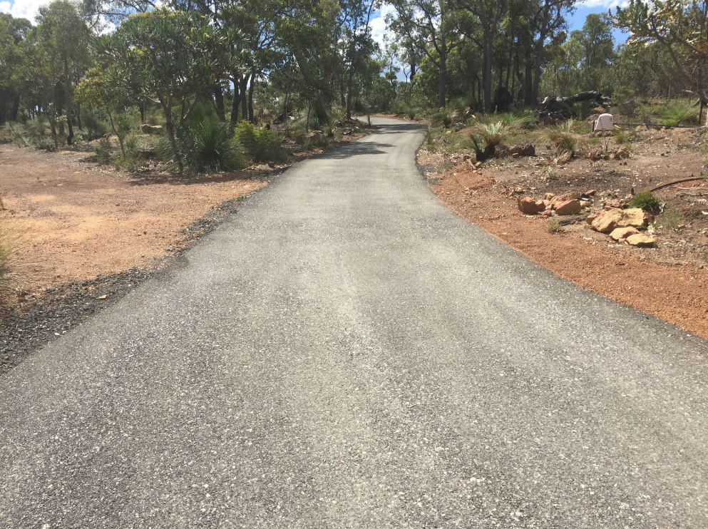 This is a photo of a hot spray & seal bitumen driveway which is in the process of being installed by Coburg Road Tech